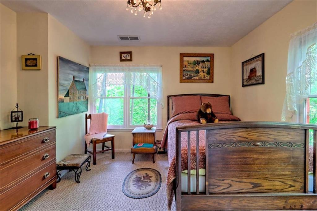 995 Glassy Mountain Road Hiawassee, GA 30546 - Photo 57 of 87 a bed room with a bed and a window