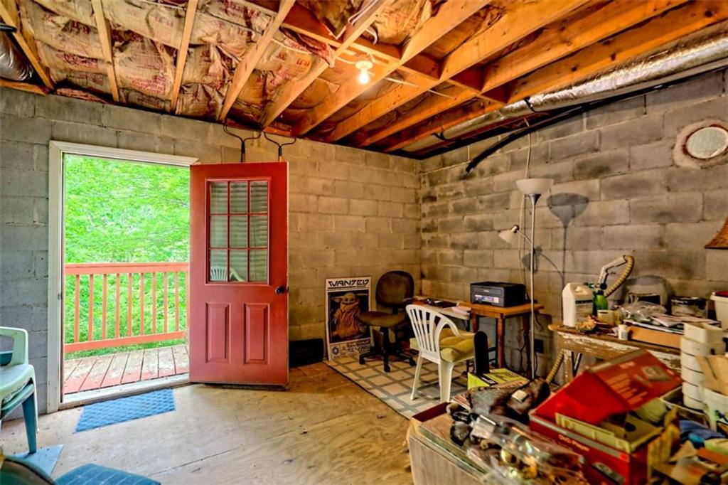 995 Glassy Mountain Road Hiawassee, GA 30546 - Photo 71 of 87 a view of a patio with table and chairs and potted plants