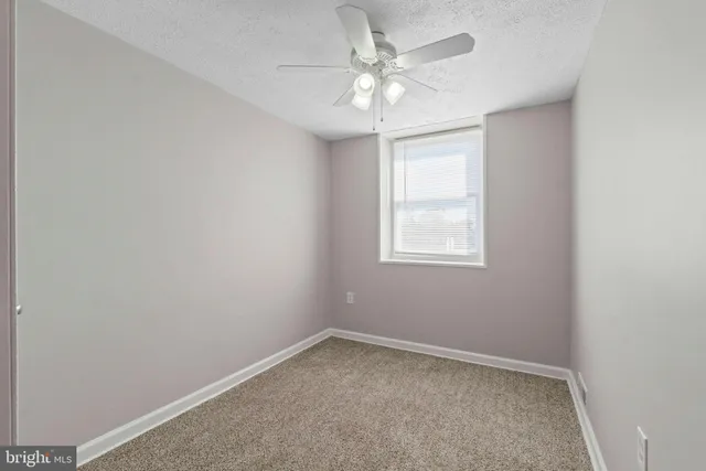 an empty room with a bathroom