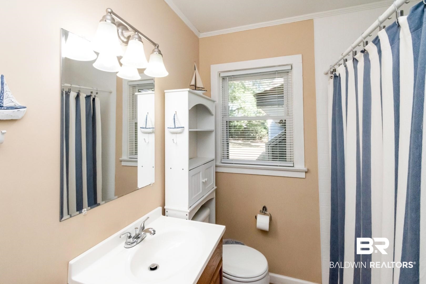 1321 Rainbow Drive West Mobile, AL 36693 - Photo 30 of 48 Bathroom featuring vanity, toilet, ornamental molding, and curtained shower