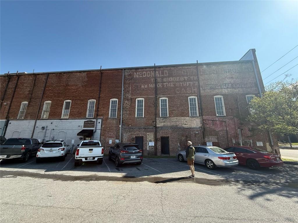 14 East 3rd Avenue Rome, GA 30161 - Photo 5 of 16 a couple of cars parked in front of a building