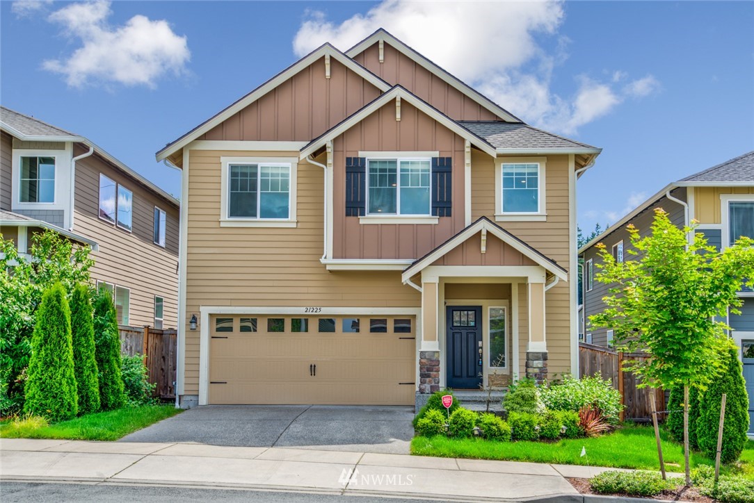21225 42nd Avenue Southeast Bothell, WA 98021 - Photo 1 of 1 a view of a house with a yard and potted plants
