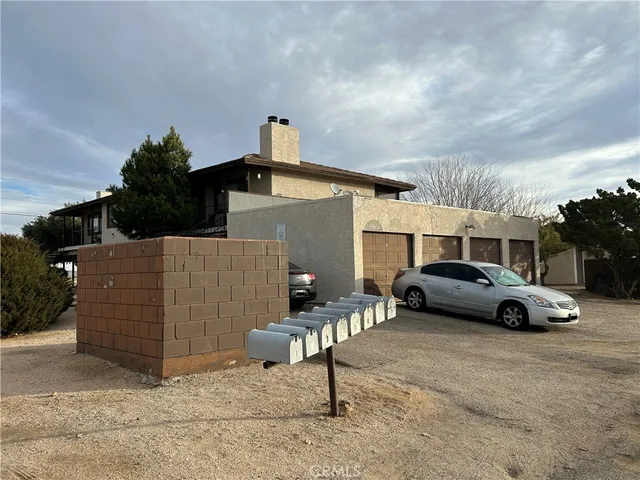 a view of a car parked in front of a house
