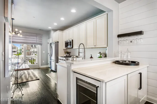 a kitchen with a stove a sink and a refrigerator