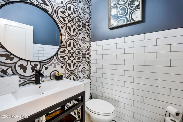 a bathroom with a toilet and a sink