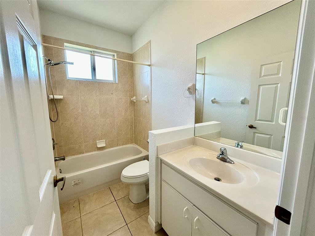 26141 Northern Cross Road Punta Gorda, FL 33983 - Photo 14 of 17 a bathroom with a sink toilet tub and shower