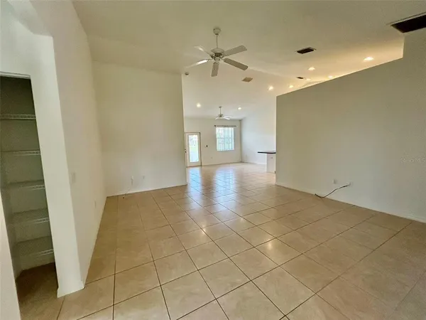 a view of an empty room and a window