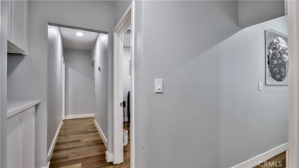 408 South Flower Street Santa Ana, CA 92703 - Photo 25 of 71 a view of a hallway with wooden floor