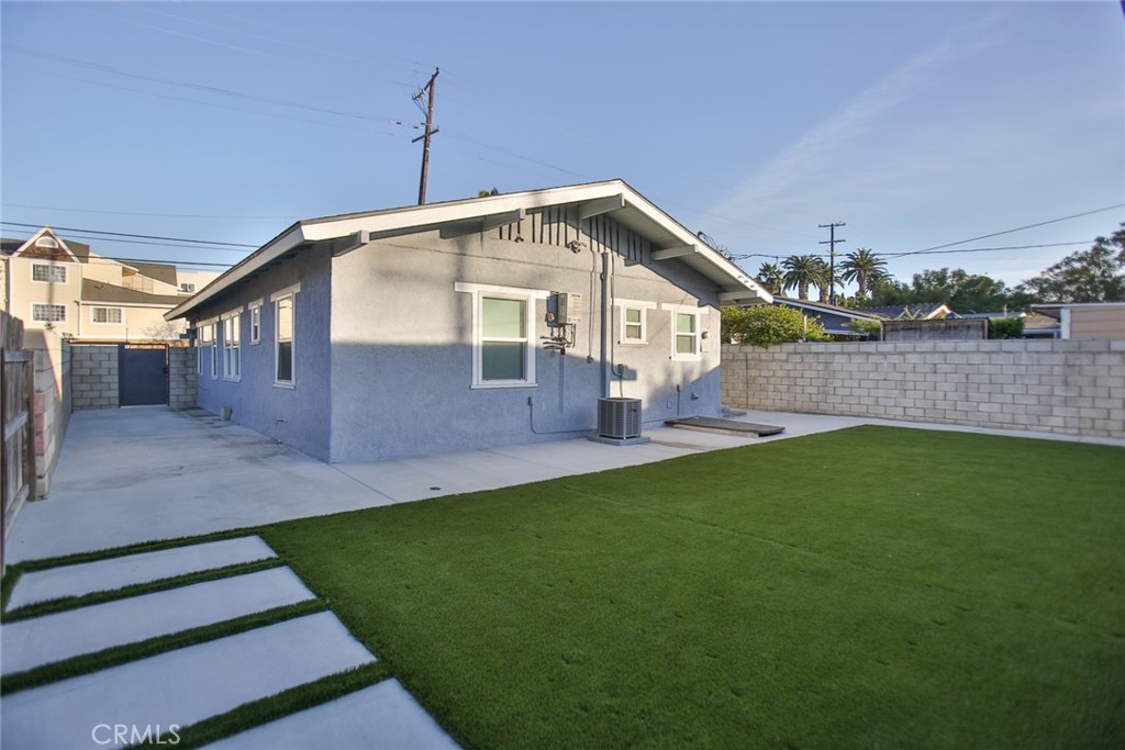 408 South Flower Street Santa Ana, CA 92703 - Photo 62 of 71 a front view of a house with a yard