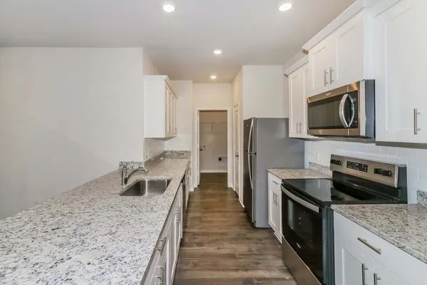 a kitchen with refrigerator and countertop