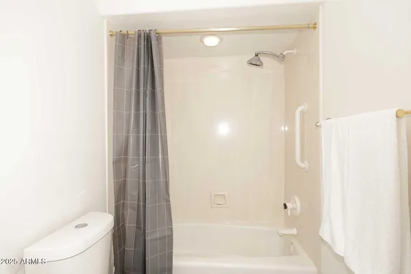 a building outdoor space with patio furniture and potted plants