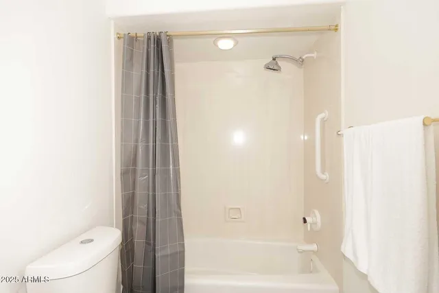 a building outdoor space with patio furniture and potted plants