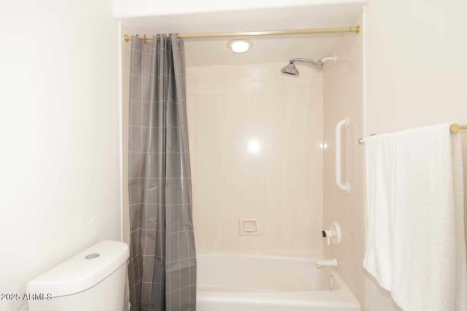 18510 East Leather Lane Rio Verde, AZ 85263 - Photo 25 of 67 a bathroom with a bathtub and a shower