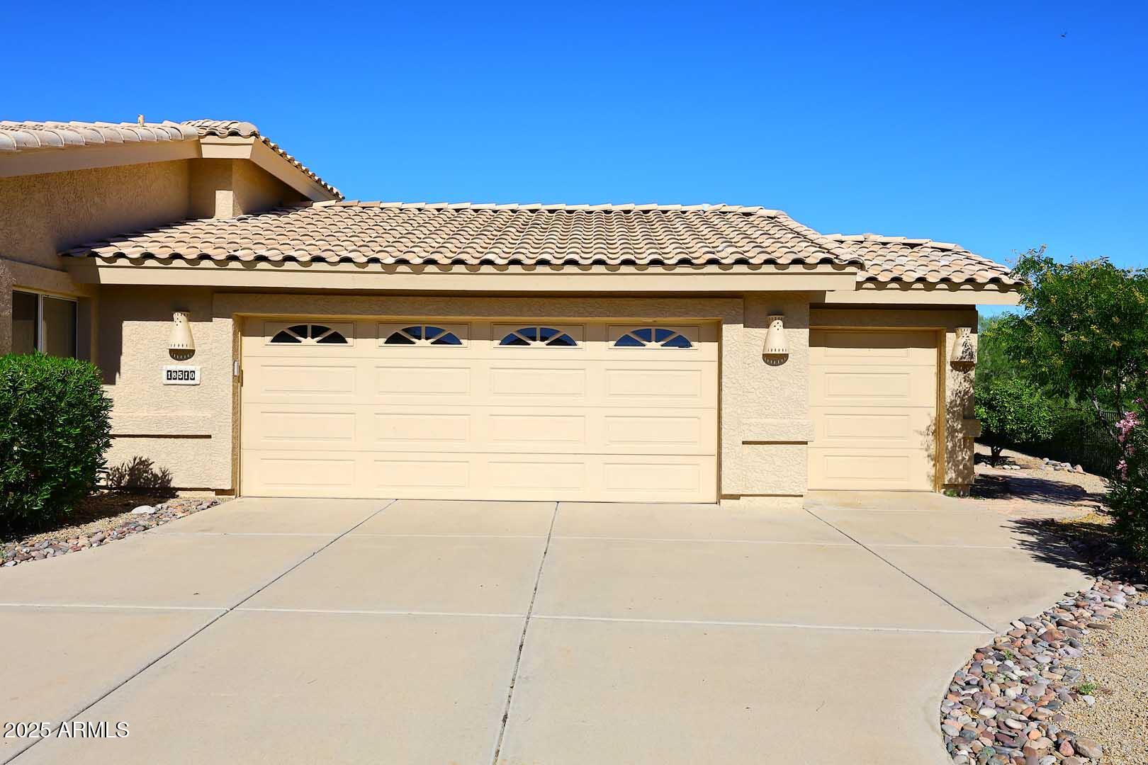 18510 East Leather Lane Rio Verde, AZ 85263 - Photo 3 of 67 a front view of a house with a yard