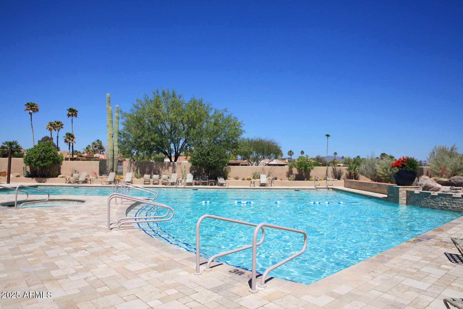 18510 East Leather Lane Rio Verde, AZ 85263 - Photo 43 of 67 a view of a swimming pool and lounge chairs