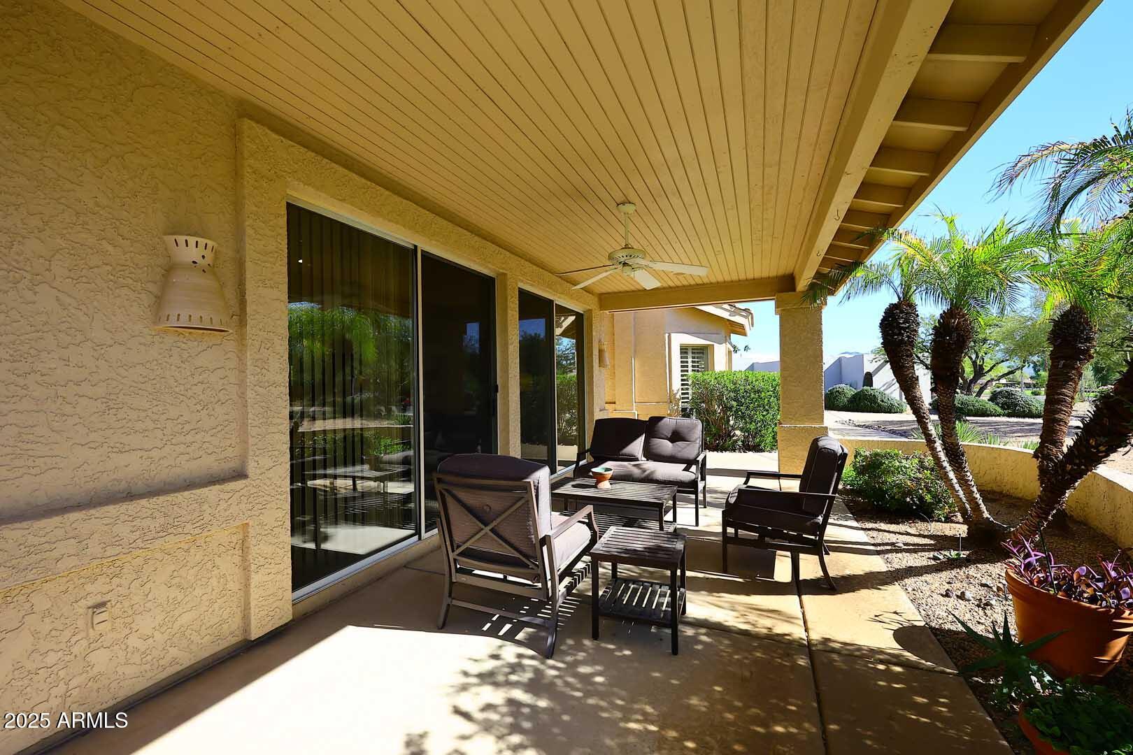 18510 East Leather Lane Rio Verde, AZ 85263 - Photo 7 of 67 a living room with patio furniture and a floor to ceiling window