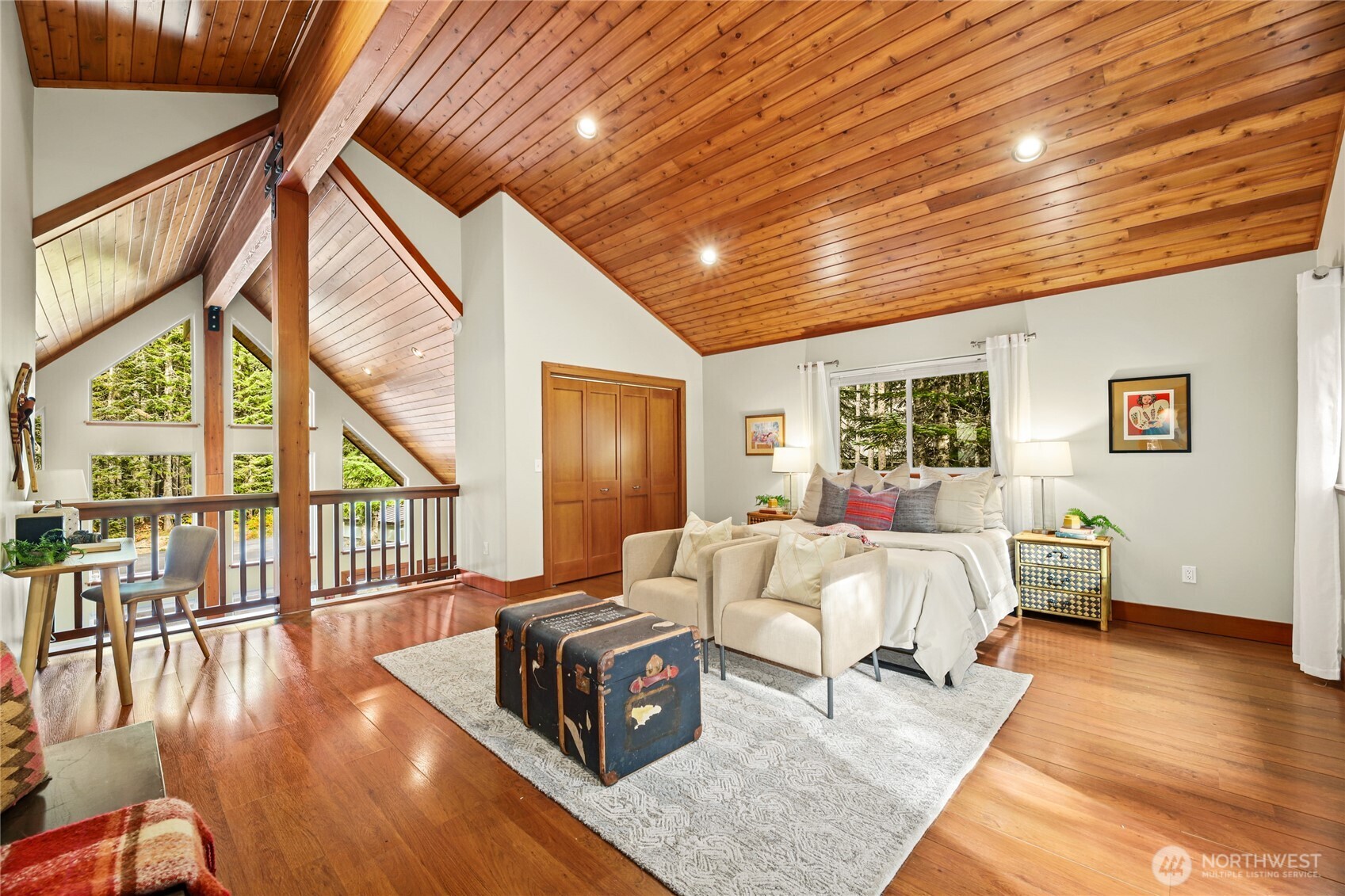 91 Mountain Home Road Snoqualmie Pass, WA 98068 - Photo 13 of 32 a spacious bedroom with wooden floor and windows