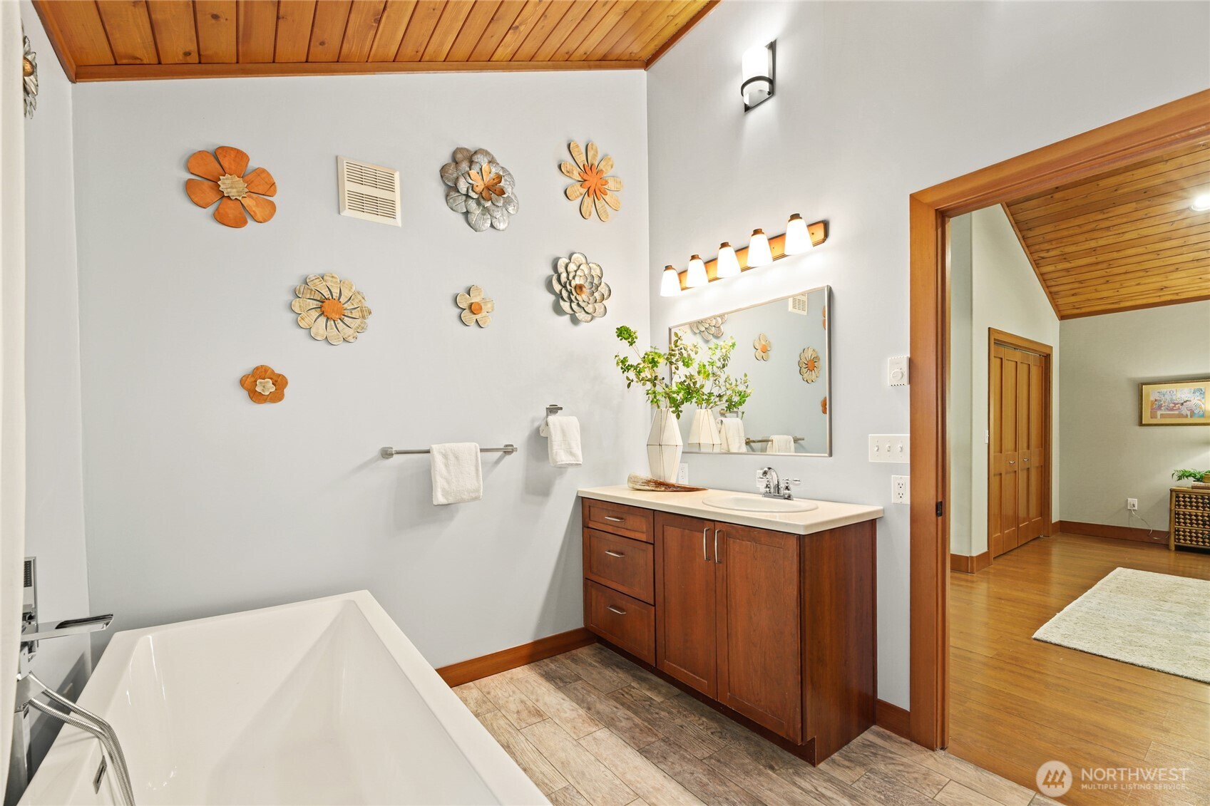 91 Mountain Home Road Snoqualmie Pass, WA 98068 - Photo 17 of 32 a bathroom with a sink a mirror and a shower