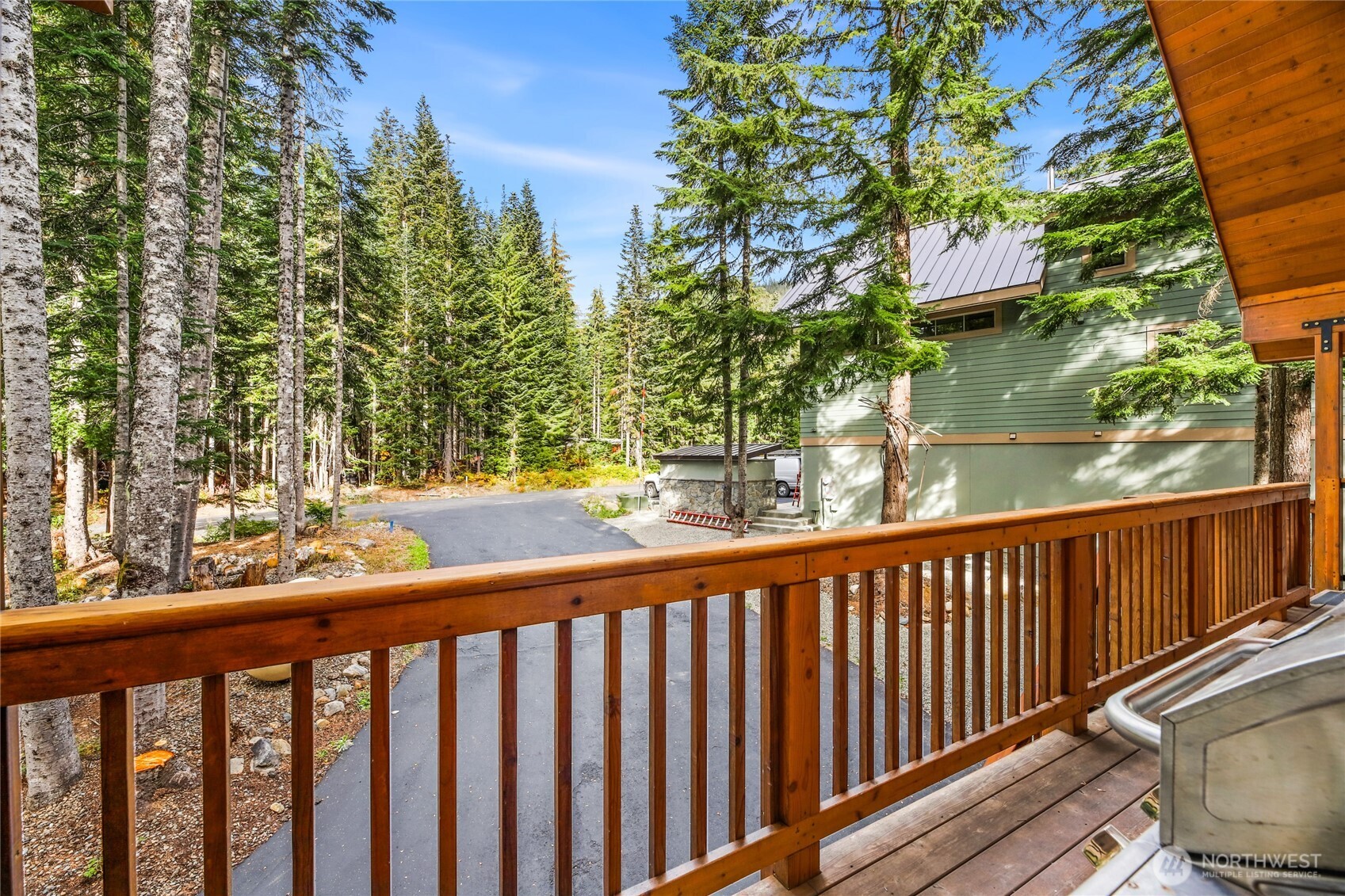 91 Mountain Home Road Snoqualmie Pass, WA 98068 - Photo 27 of 34 a view of trees and deck in the balcony