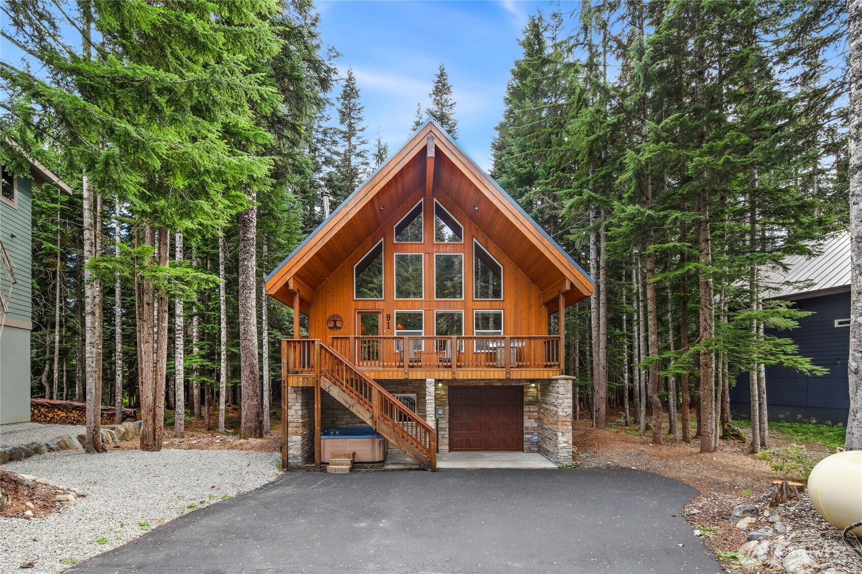 91 Mountain Home Road Snoqualmie Pass, WA 98068 - Photo 31 of 32 a view of a house with a yard and large trees