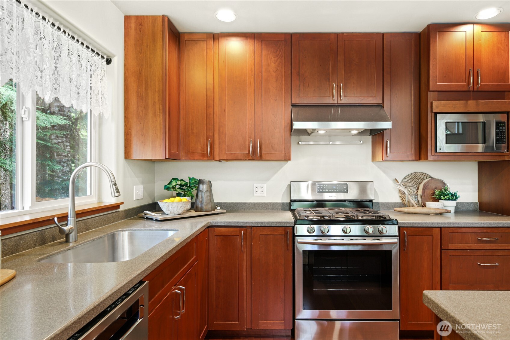 91 Mountain Home Road Snoqualmie Pass, WA 98068 - Photo 8 of 32 a kitchen with stainless steel appliances a stove a sink a stove and cabinets