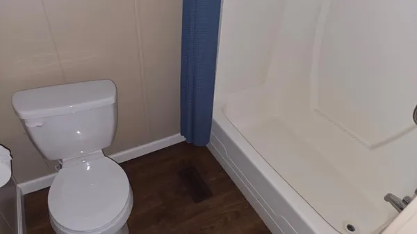a bathroom with a toilet and a sink