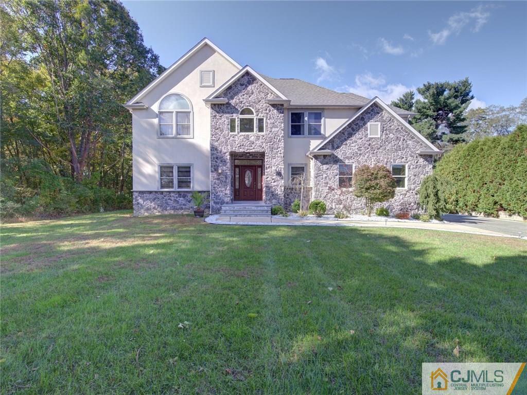 110 Cottrell Road Old Bridge, NJ 07747 - Photo 1 of 25 a front view of a house with a yard and trees