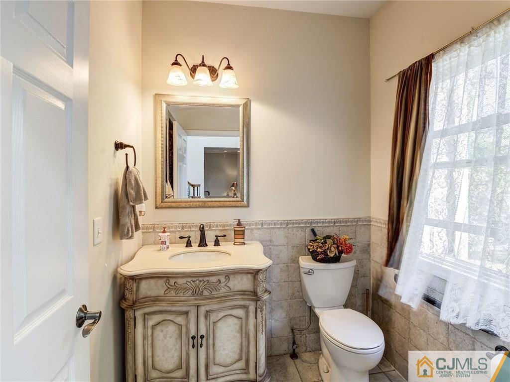 110 Cottrell Road Old Bridge, NJ 07747 - Photo 14 of 25 a bathroom with a sink and a mirror