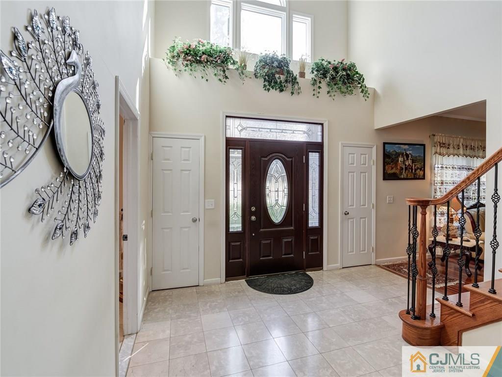 110 Cottrell Road Old Bridge, NJ 07747 - Photo 2 of 25 a view of a livingroom with furniture and a fireplace