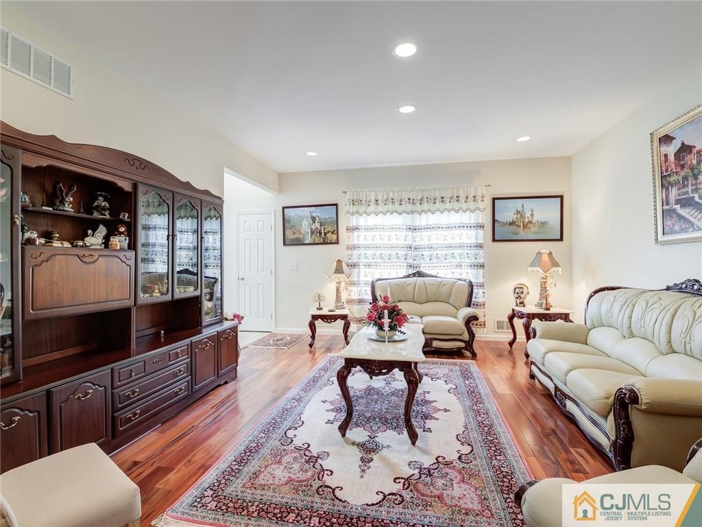 110 Cottrell Road Old Bridge, NJ 07747 - Photo 4 of 25 a living room with furniture and a flat screen tv