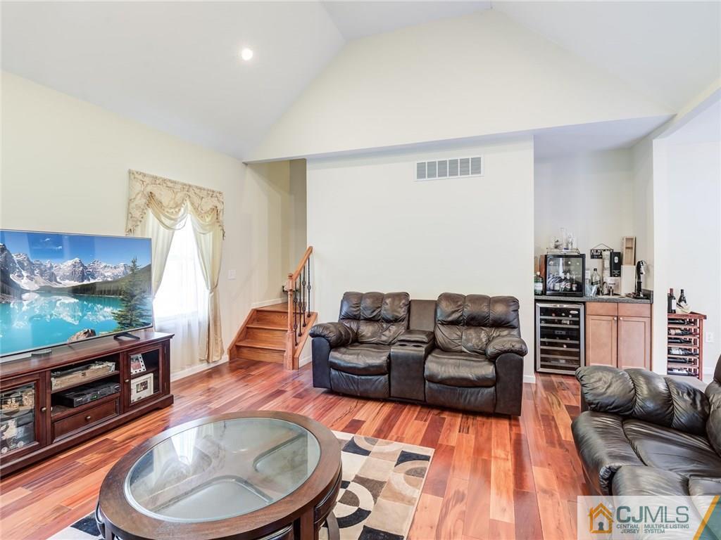 110 Cottrell Road Old Bridge, NJ 07747 - Photo 7 of 25 a living room with furniture and a flat screen tv