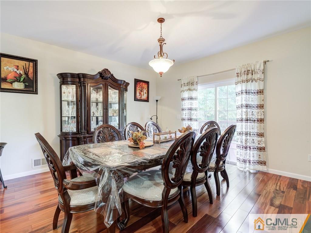 110 Cottrell Road Old Bridge, NJ 07747 - Photo 8 of 25 a view of a dining room with furniture window and wooden floor