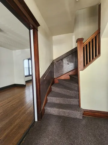 a view of hall way with furniture