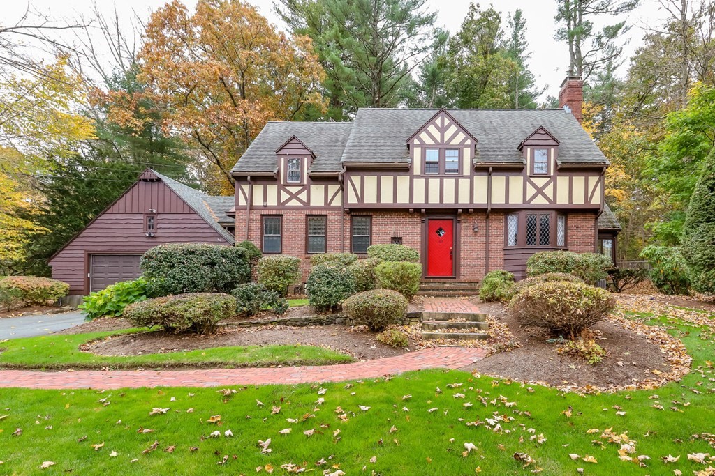 a front view of house with yard and green space