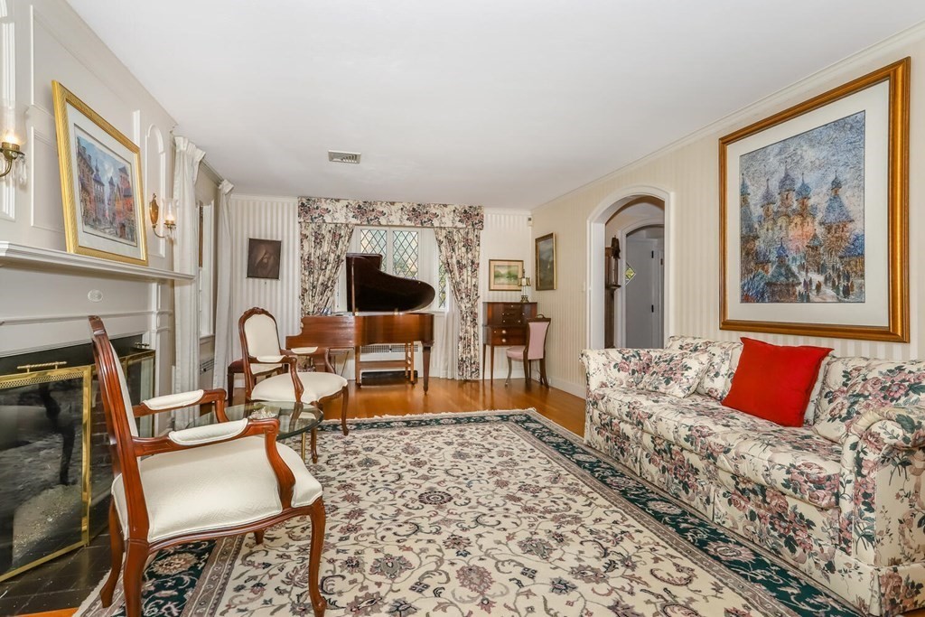 160 High Street Canton, MA 02021 - Photo 11 of 22 a living room with furniture a fireplace and a flat screen tv