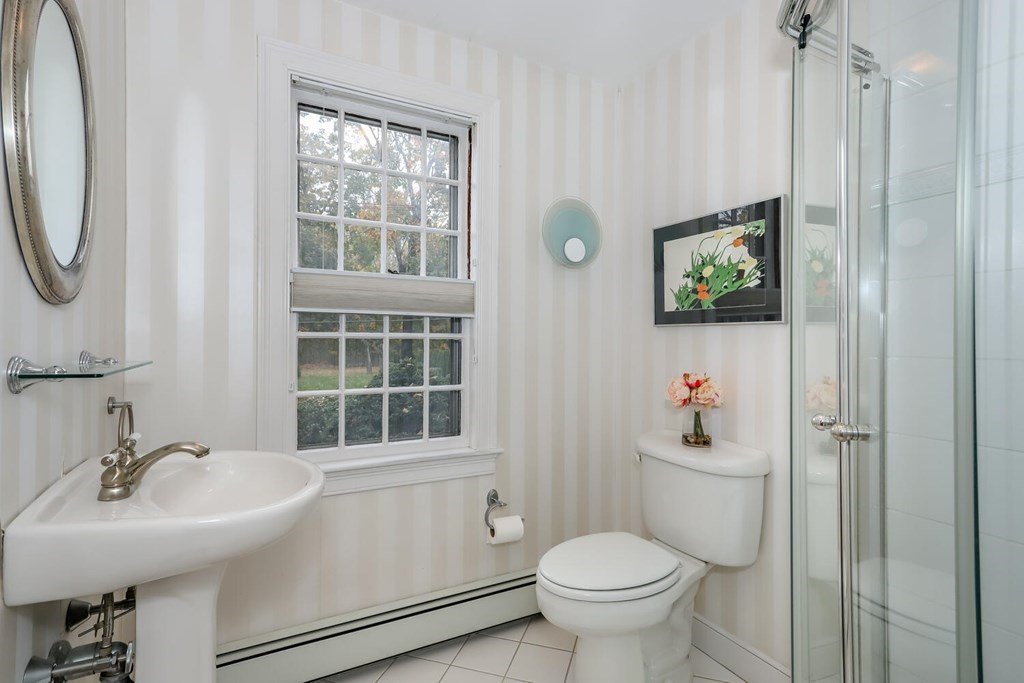 160 High Street Canton, MA 02021 - Photo 12 of 22 a bathroom with a sink mirror toilet and next to a window