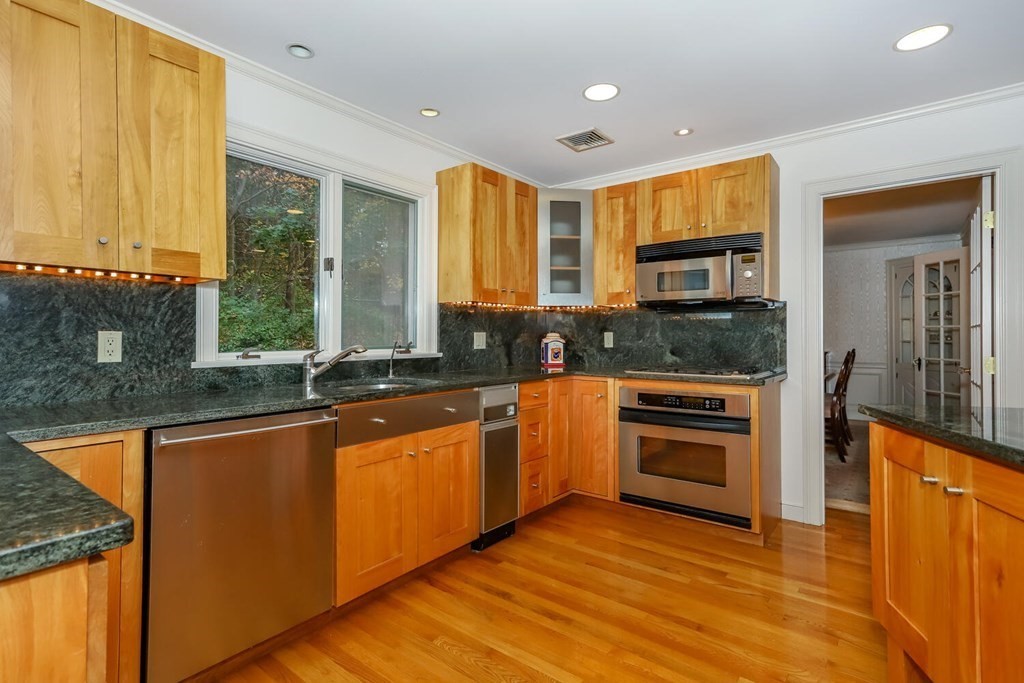 160 High Street Canton, MA 02021 - Photo 5 of 22 a kitchen with stainless steel appliances granite countertop a stove a sink and a microwave