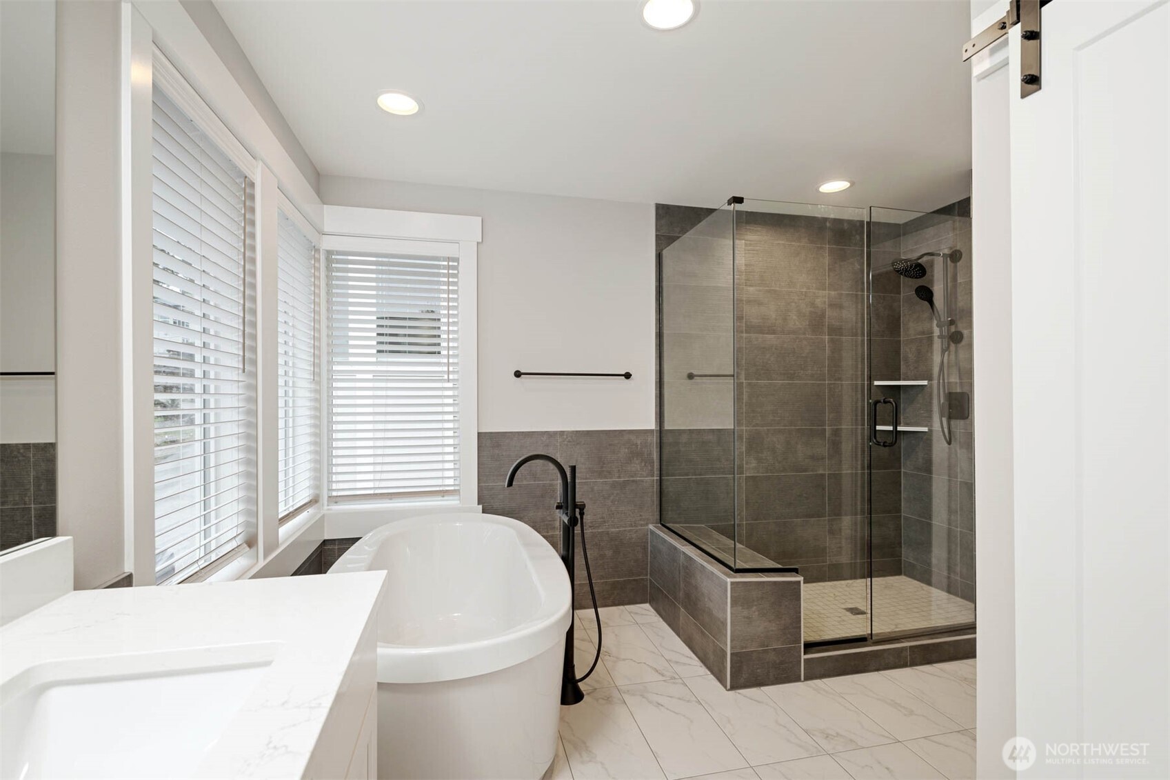 7560 South 130th Place Seattle, WA 98178 - Photo 11 of 27 a bathroom with a toilet and a shower