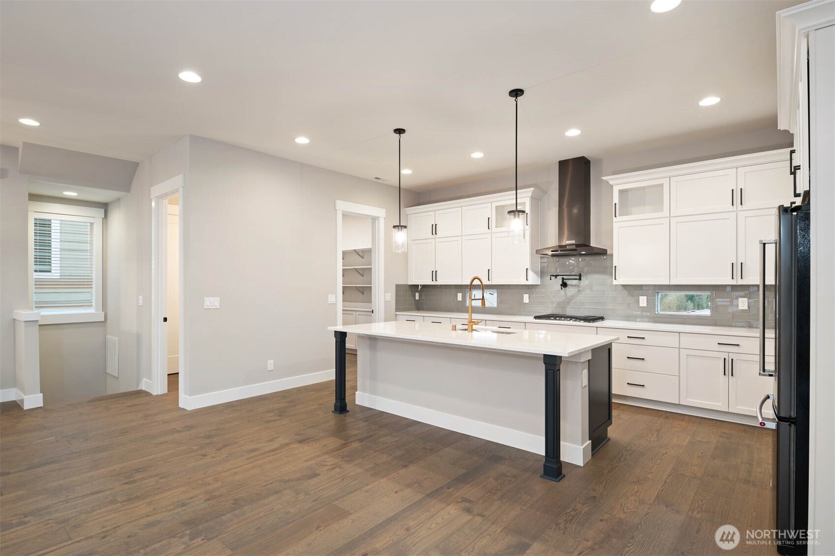 7560 South 130th Place Seattle, WA 98178 - Photo 24 of 27 a large kitchen with cabinets