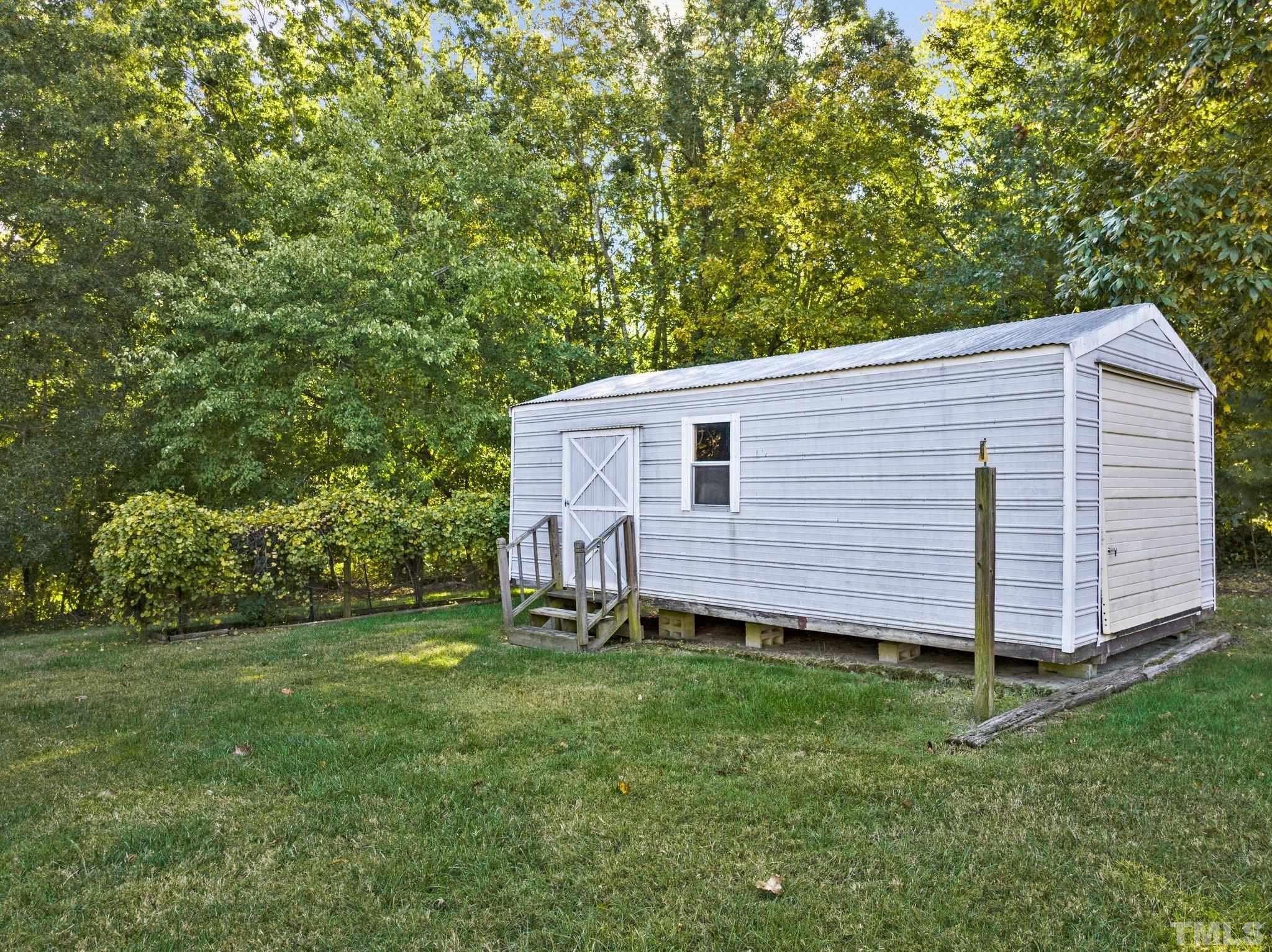 450 Younger Road Roxboro, NC 27573 - Photo 13 of 43 a view of a back yard of the house