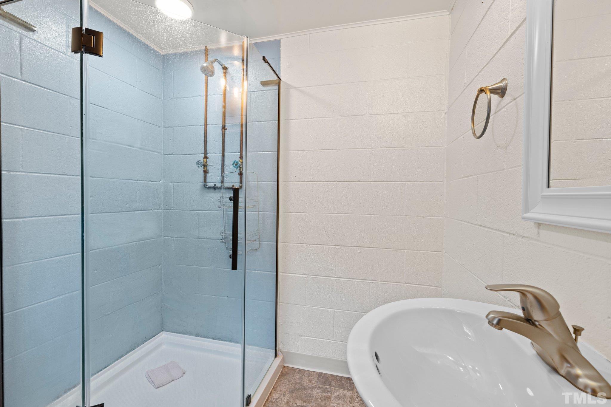 450 Younger Road Roxboro, NC 27573 - Photo 29 of 43 a bathroom with a sink and shower
