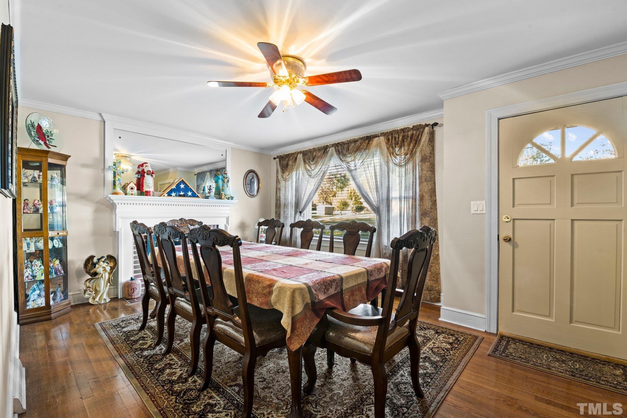 450 Younger Road Roxboro, NC 27573 - Photo 39 of 43 a view of a dining room with furniture window and wooden floor