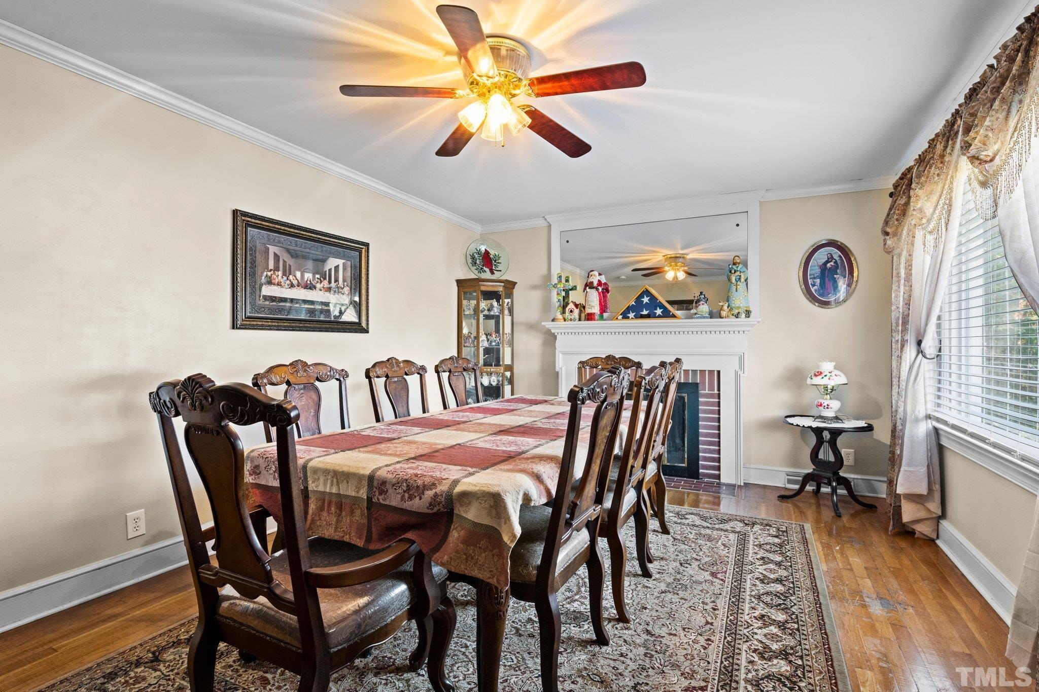 450 Younger Road Roxboro, NC 27573 - Photo 40 of 43 a view of a dining room with furniture and wooden floor