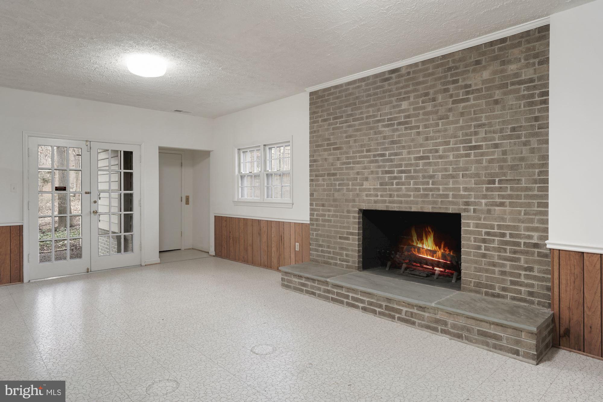 4062 Ridgeview Circle McLean, VA 22101 - Photo 20 of 56 Recreation Room with fireplace and French doors