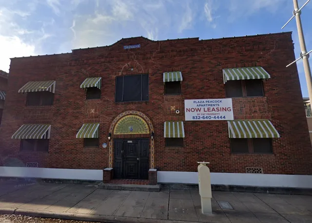 a front view of a house with parking area