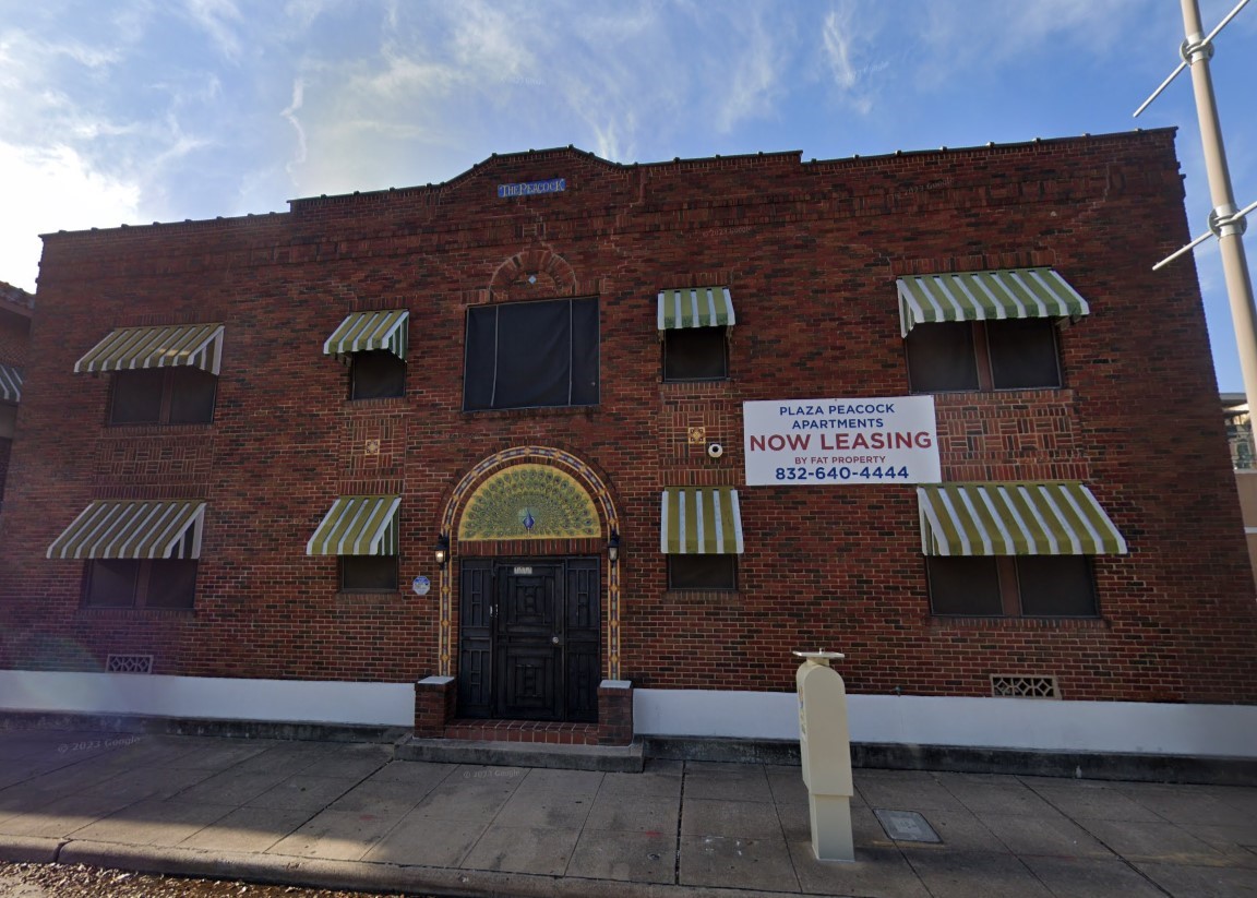 a front view of a house with parking area