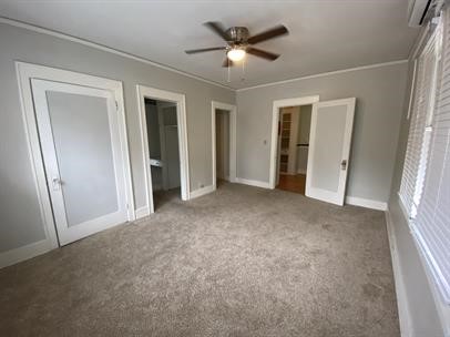 1414 Austin Street, Unit 16 Houston, TX 77002 - Photo 4 of 10 a view of a big room with closet and a ceiling fan