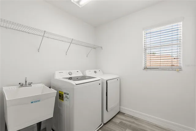 a utility room with dryer and washer