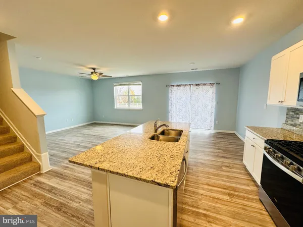 a bedroom with a bed and cabinets
