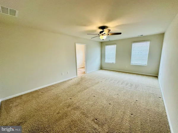 a view of a big room with carpet